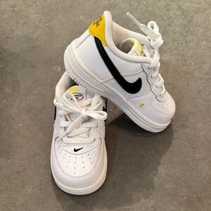 Nike Kids White Sneakers with Black and Yellow Accents
